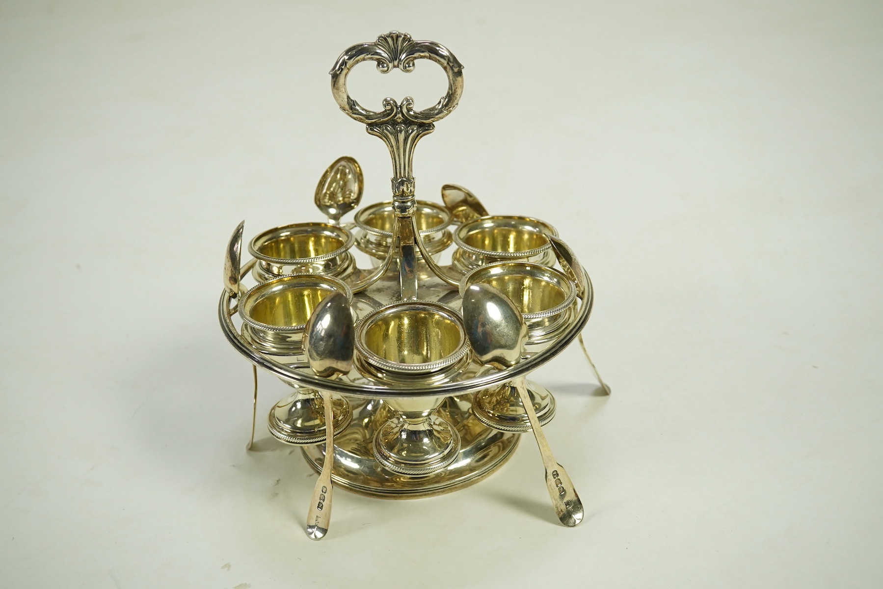 A George III silver egg cruet stand, with six egg cups and six spoons (one not matching), by Solomon Royes & John East Dix